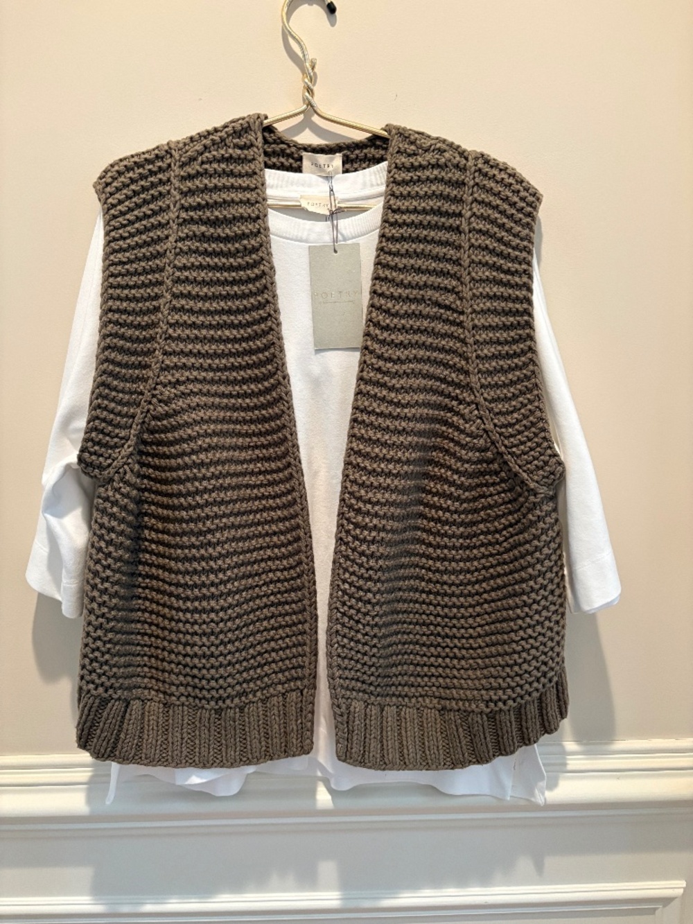 Poetry hand knitted waistcoat and dolman-sleeve top.